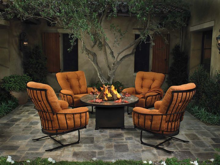 Monterra Spring Base Lounge Chair Shown with Fire Pit and Swivel Rocker Lounge Chair
