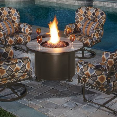 OW Lee Casual Fireside 42 Round Santorini Chat Fire Pit Shown with Lounge Chairs