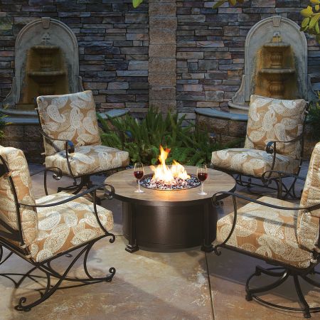 OW Lee Casual Fireside 42 Round Santorini Chat Fire Pit Shown with Lounge Chairs