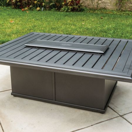 Tropitone Banchetto 54X42 Rectangular Fire Pit Shown With Optional Closed Lid On The Patio.