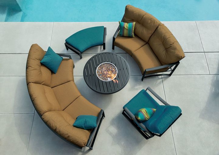 Tropitone Kenzo Cushion Cresent Sofa, Cresent Love Seat, Swivel Action Lounge Chair, and Cresent Ottoman Shown with Banchetto 42 Round Fire Pit Aerial View